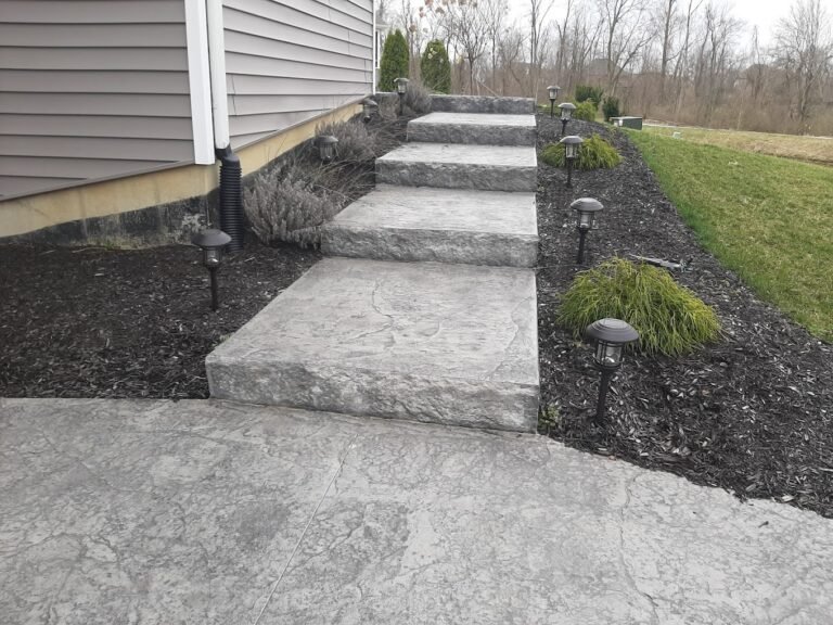 Concrete Steps leading to backyard, showing off Crystal Creek's work - the best concrete contractor in Roanoke, IN.