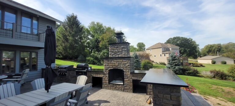 Concrete patio with a custom wall showing off Crystal Creek, the best Concrete contractor in Columbia City, IN