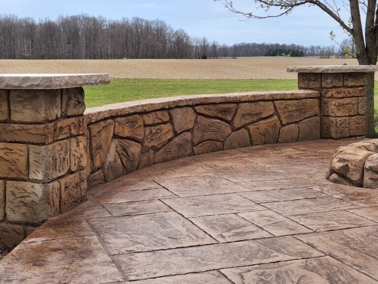 Retaining wall with land behind it. Showing Crystal Creek, the best concrete contractor in Leo-Cedarville, IN.