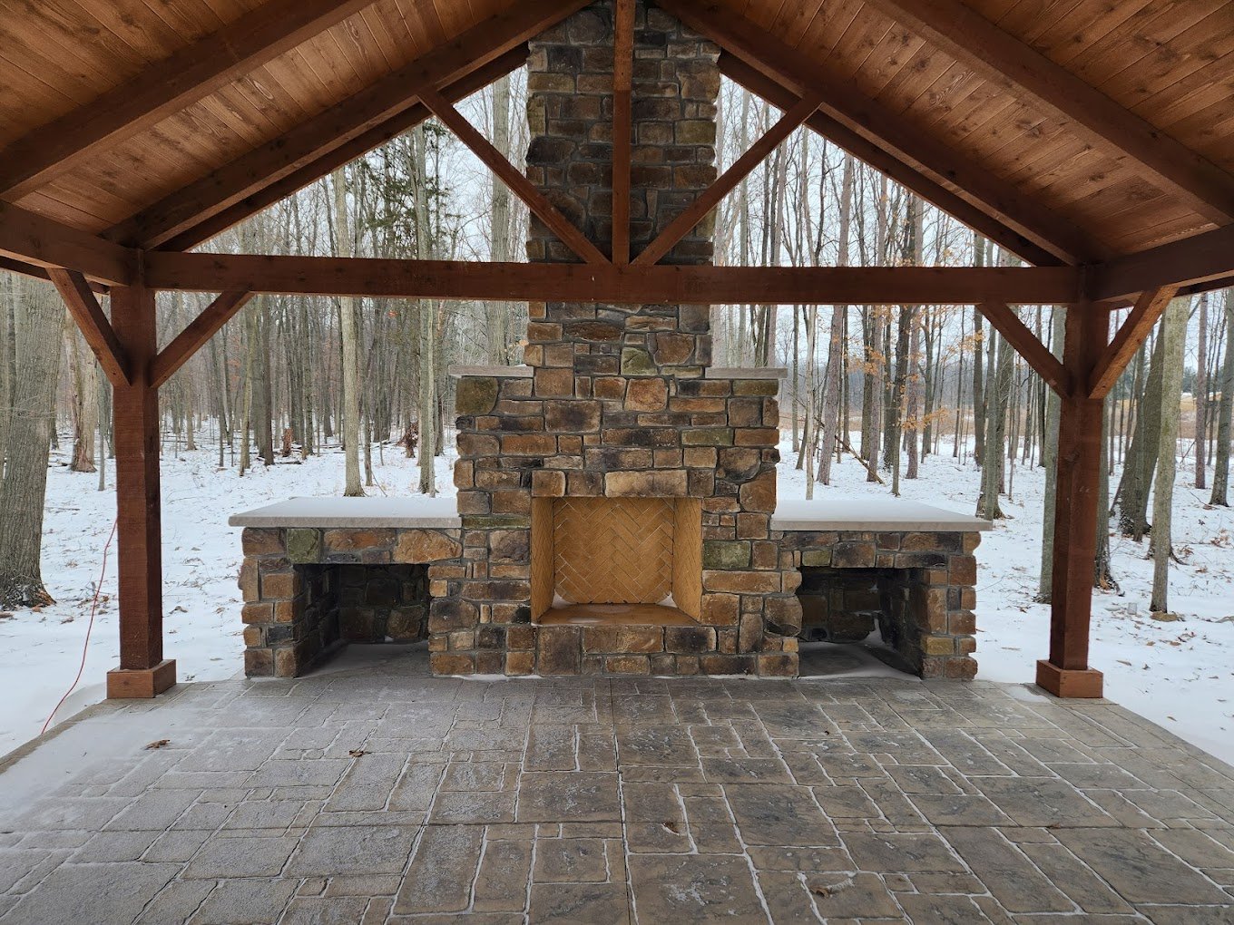 Concrete contractor in Columbia City. Beautiful concrete patio next to a stone fireplace