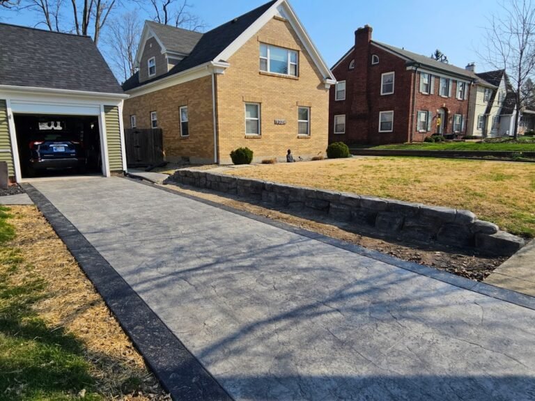 Stamped Driveway with a dark grey border. Showing off Crystal Creek's work - the best concrete contractor in Waterloo, IN