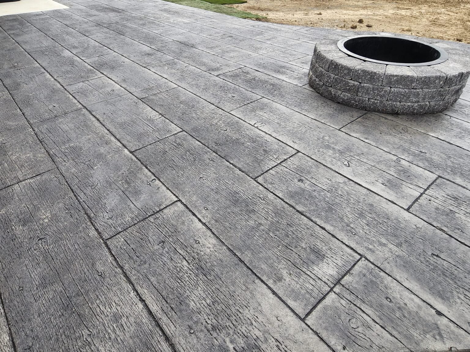 stamped concrete in Hicksville with a wood texture.