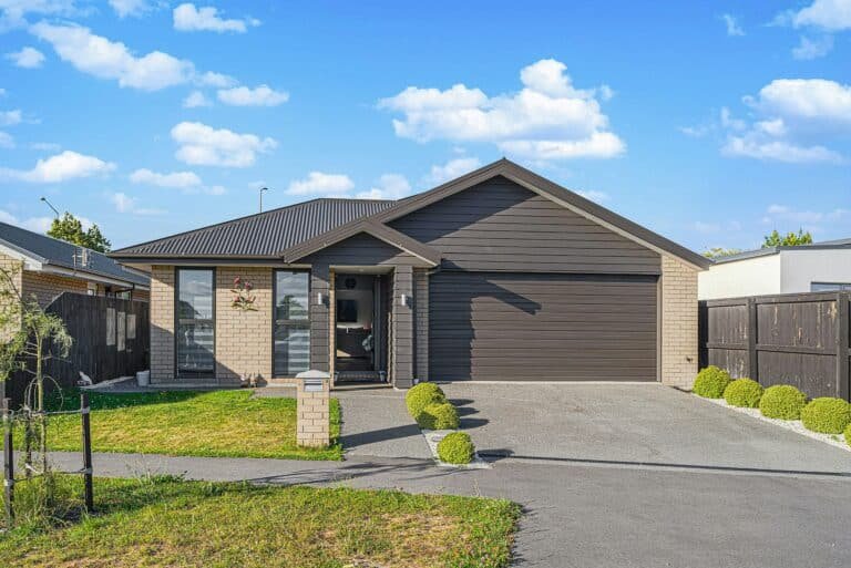 home with a new driveway and finishes following expert concrete work