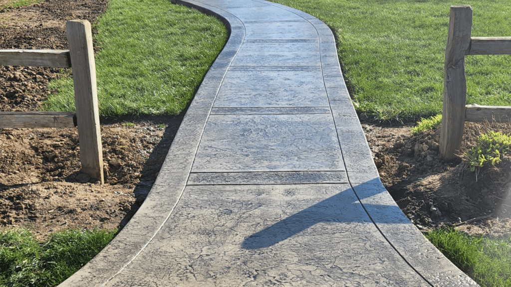 Concrete walkway leading to the front entrance of a residential home in Fort Wayne, Indiana